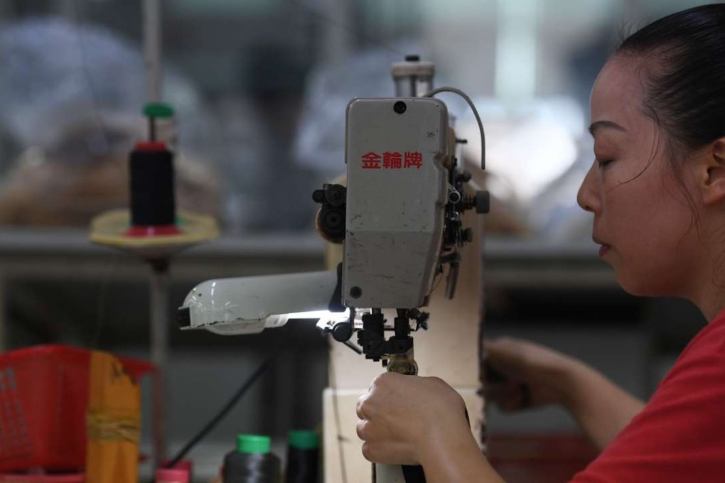 A file picture of a worker at a shoe factory in Guangdong province. Photo: AFP