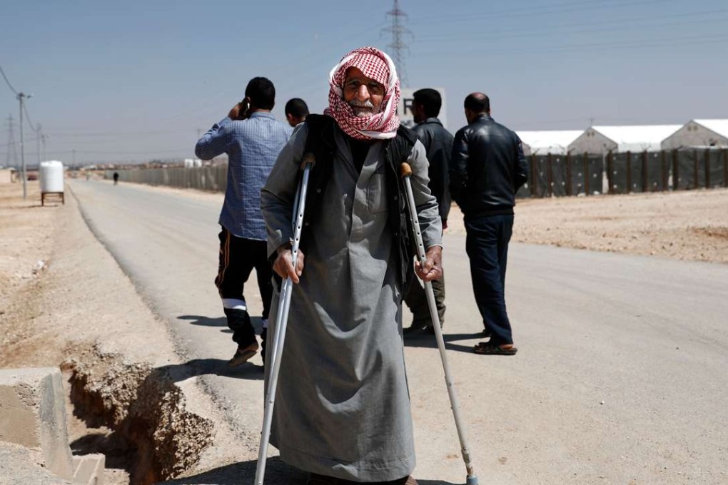 A Syrian refugee gets by on crutches as the country’s devastating civil war, now in its seventh year, has rendered more than half the country's population refugees. The conflict has left more than 320,000 people dead, according to the Syrian Observatory for Human Rights. Photo: AFP
