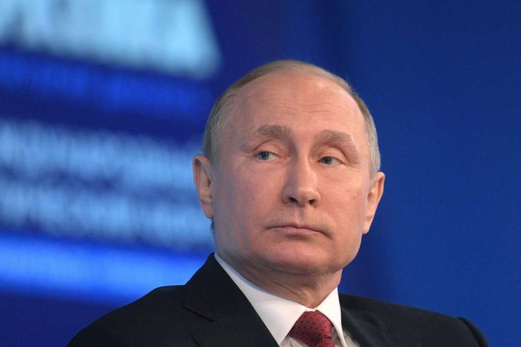 Russian President Vladimir Putin attends a plenary session of the 'Arctic: Territory of Dialogue' International Forum in Arkhangelsk, Russia. He denied strongly that Moscow interfered in the US presidential election in 2016. Photo: EPA