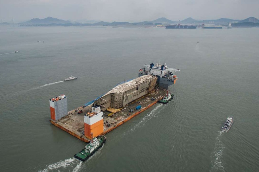 The wreck of the Sewol ferry arrives at a port in Mokpo. Photo: AFP