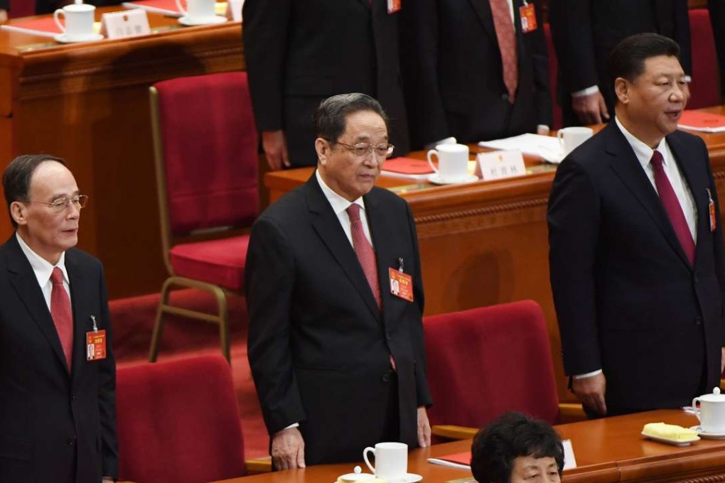 Top leaders including Wang Qishan (left)) and Xi Jinping sing the national anthem in the Great Hall of the People in Beijing. Photo: AFP