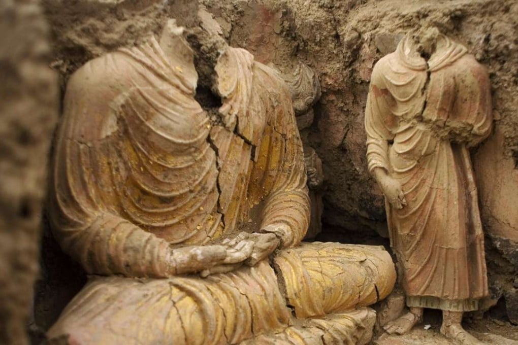 This 2010 photograph shows ancient Buddha statues inside a temple in Mes Aynak, Afghanistan, where a Chinese consortium has the rights to mine for copper. Photo: AP