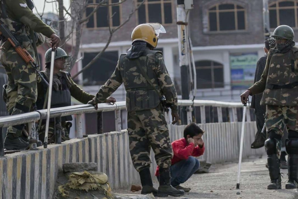 Indian soldiers force a Kashmiri child to perform sit-ups while holding his ear lobes, a common elementary school punishment in India, before letting him go during a strike in Indian-controlled Kashmir. Photo: AP