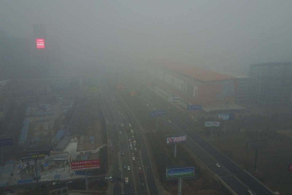Buildings and roads are shrouded in smog in the Yanjiao district of Sanhe, Hebei province, in January. Photo: EPA