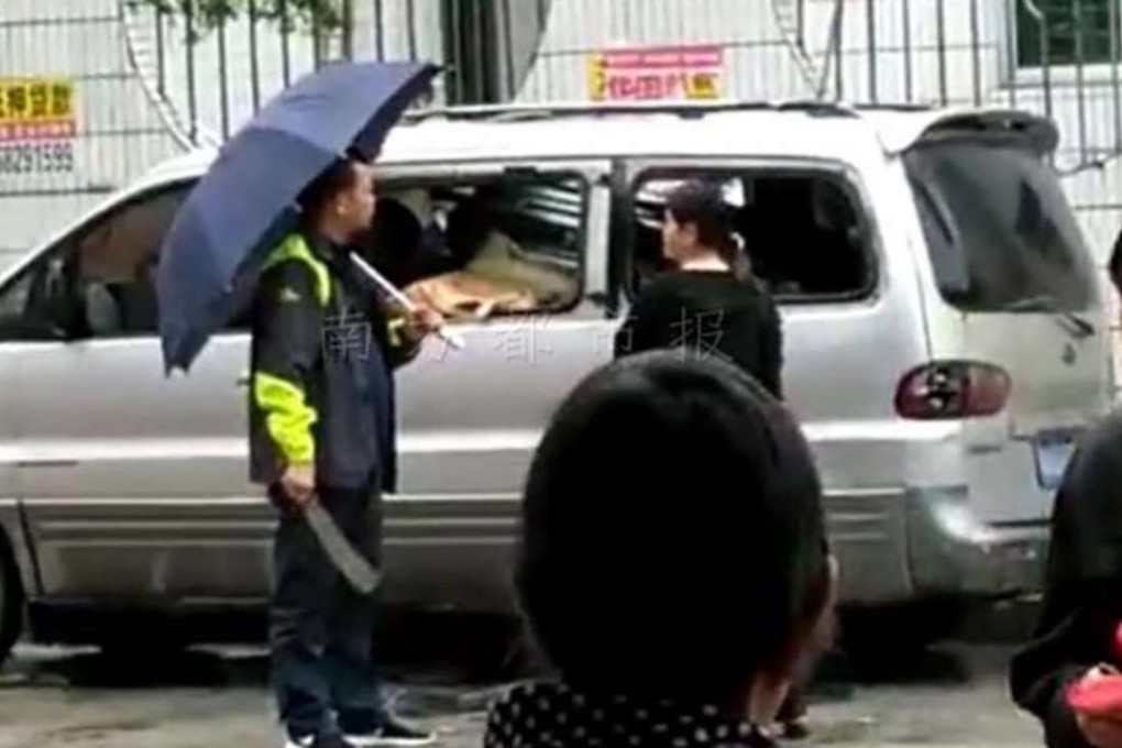 Liang Xiongzhi ‘opened’ the window of minivan where the villain was hiding. Photo: Handout