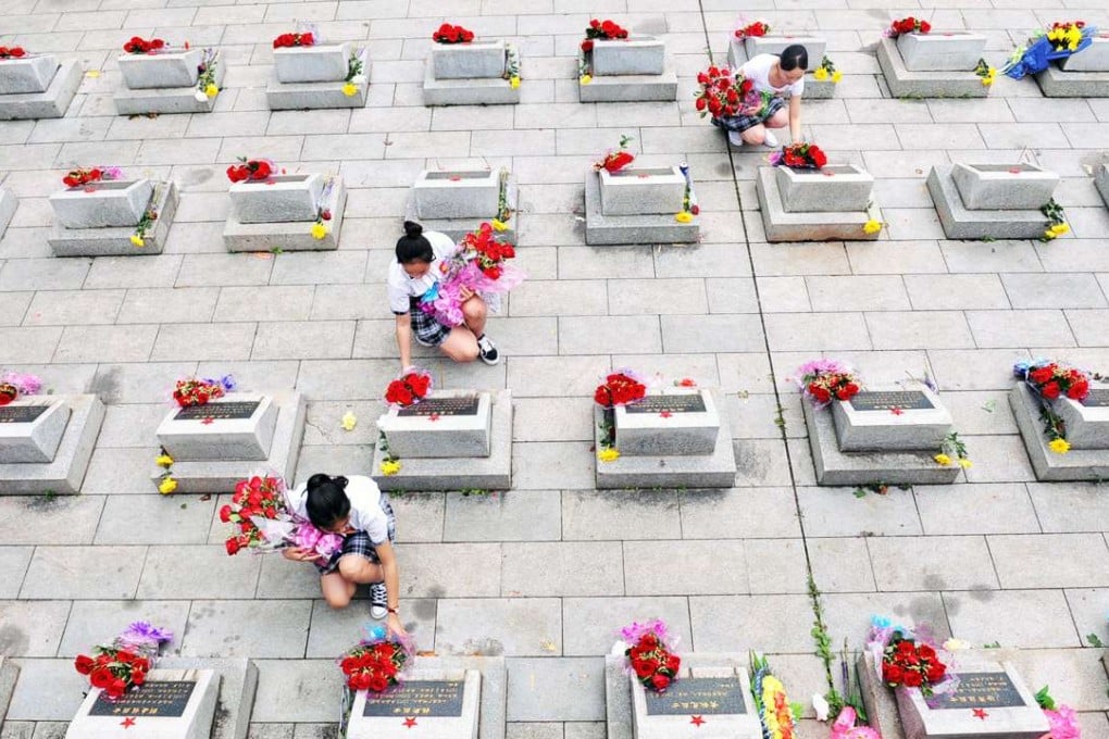 China’s ageing population and scarce urban land supply have pushed up prices for grave sites, igniting a search for alternative burial methods. Students place bouquets at a martyr cemetery ahead of China's Qingming Festival, or Tomb Sweeping Day, in Pingxiang. Photo: Reuters