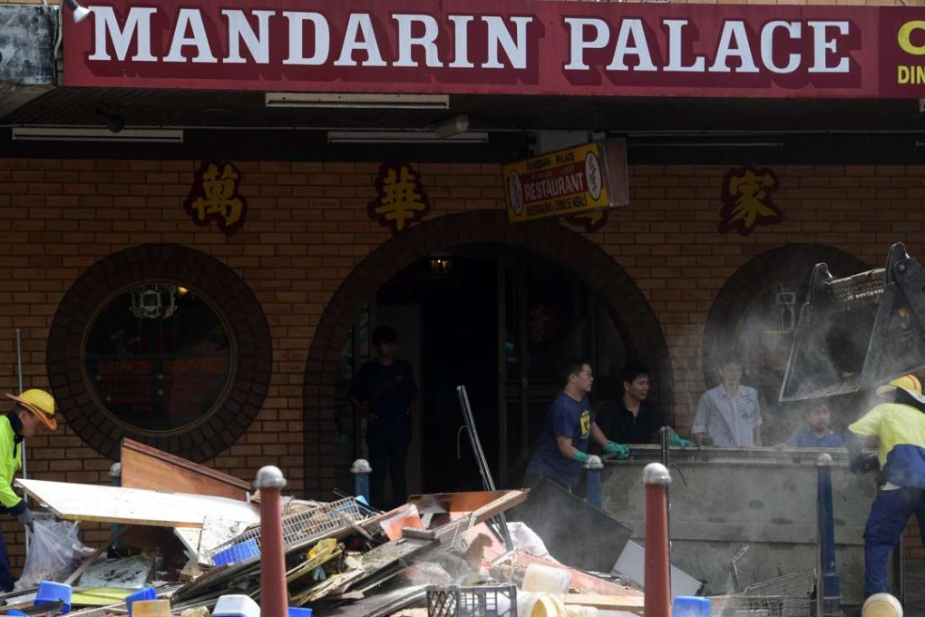 The clean-up operation is under way in the flood ravaged centre of Lismore, New South Wales. Photo: EPA