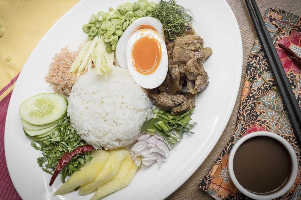 Rice salad with crispy sweet pork, herbs, sour mango and shrimp paste at Soul Food.