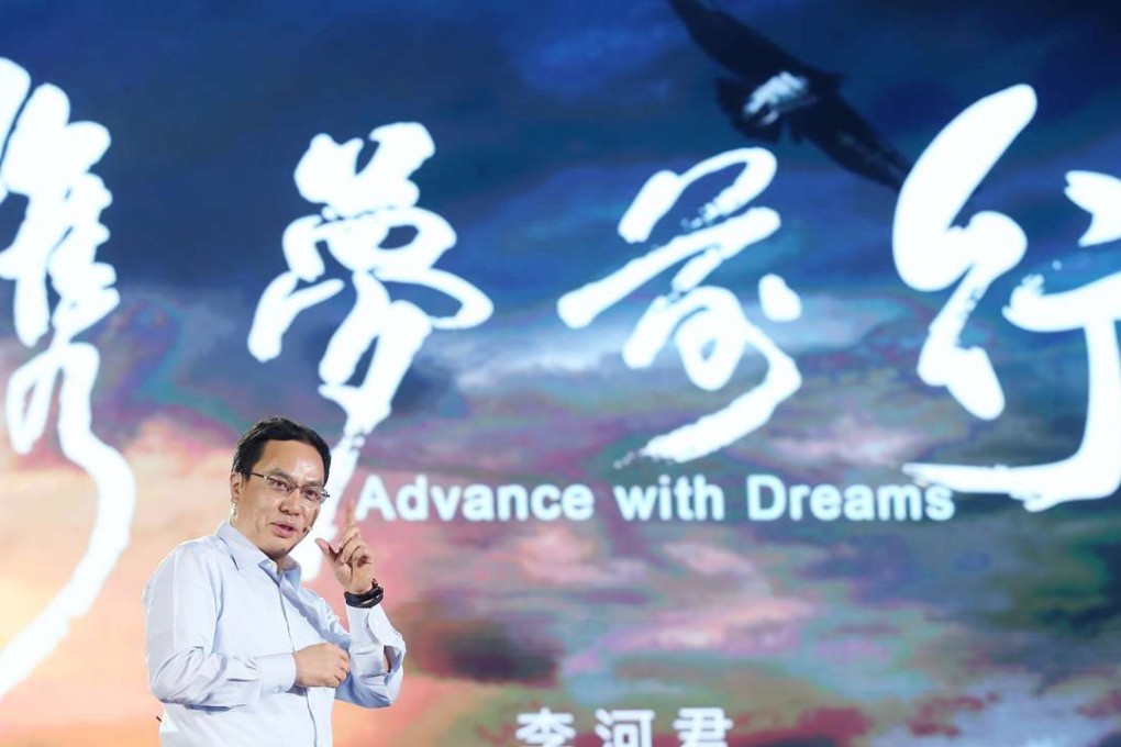Hanergy Holding’s chairman Li Hejun introduces the company's solar-powered vehicles in Beijing. Photo: SCMP