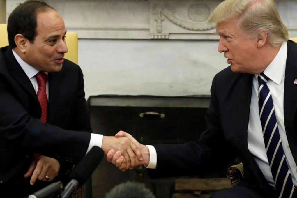 US President Donald Trump shakes hands with Egyptian President Abdel Fattah al-Sisi in the Oval Office of the White House in Washington. Photo: Reuters