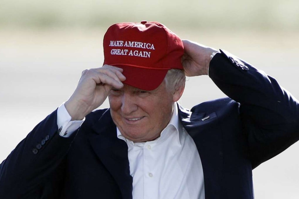 Donald Trump wears a ‘Make America Great Again’ cap at a campaign rally in Sacramento, California, in June last year. Photo: AP