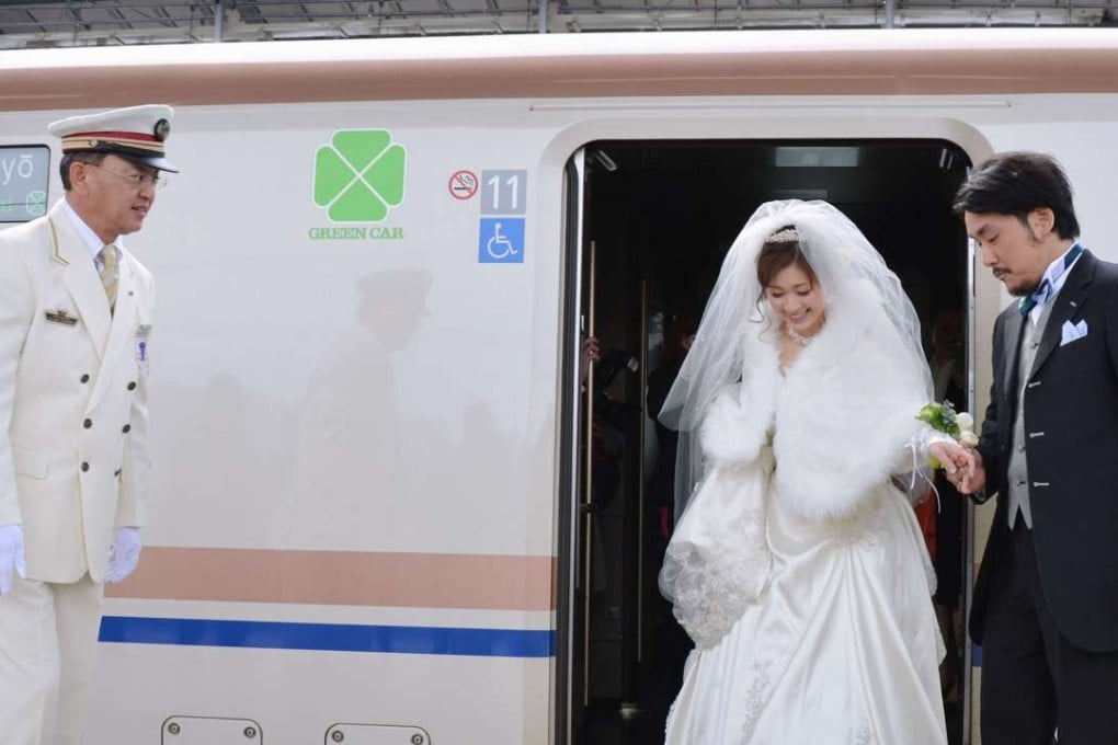 A couple arrive at JR Karuizawa Station for an open wedding ceremony. Nearly one in every four men and one in every seven women in Japan had remained unmarried until age 50 in 2015 in a clear sign that Japanese people are increasingly shying away from tying the knot, Photo: Kyodo