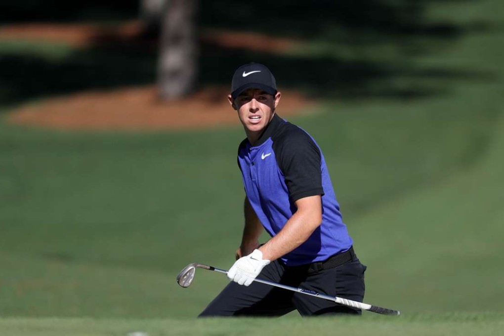 Rory McIlroy checks out one of the greens during a practice round at Augusta National on Tuesday. Photo: AFP