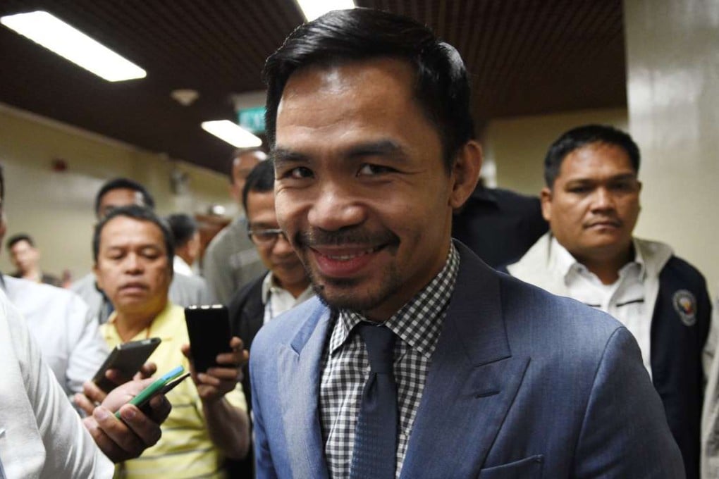 Philippine boxing icon and Senator Manny Pacquiao arriving for a senate session in Manila. Photo: AFP