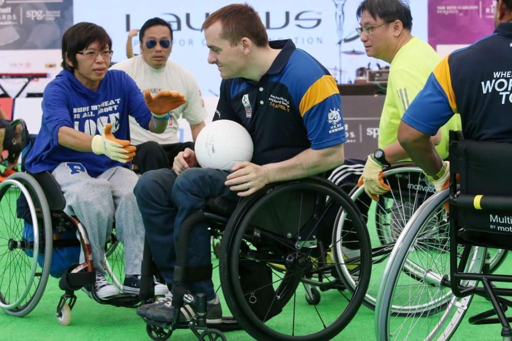 Andy Barrow (centre) gives a demonstration of wheelchair rugby at Chater Garden in Central. Photos: David Wong