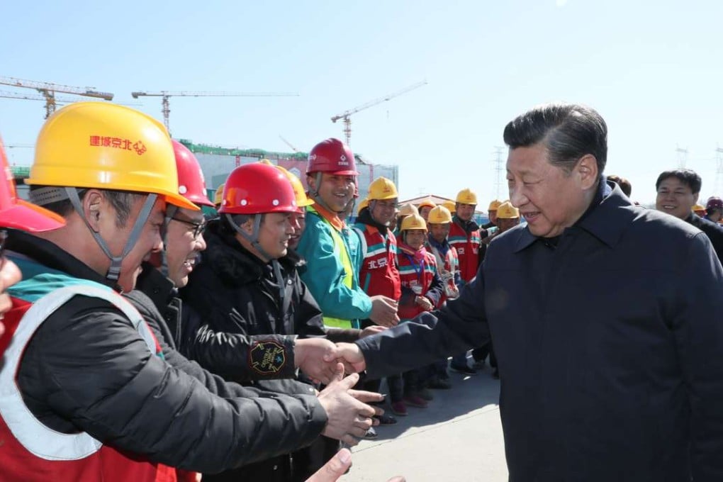 Chinese President Xi Jinping shakes hands with workers at the construction site of the capital's subsidiary administrative centre in Beijing. Photo: Xinhua