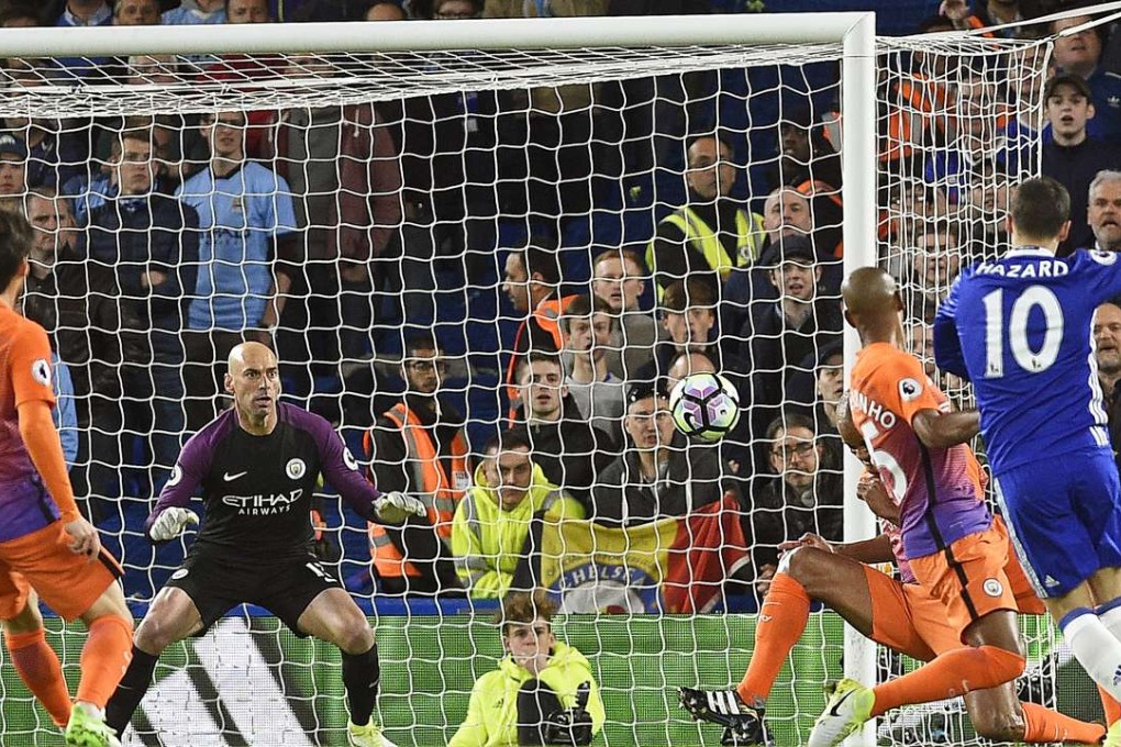 Chelsea’s Eden Hazard scores against Manchester City at Stamford Bridge. Photo: EPA