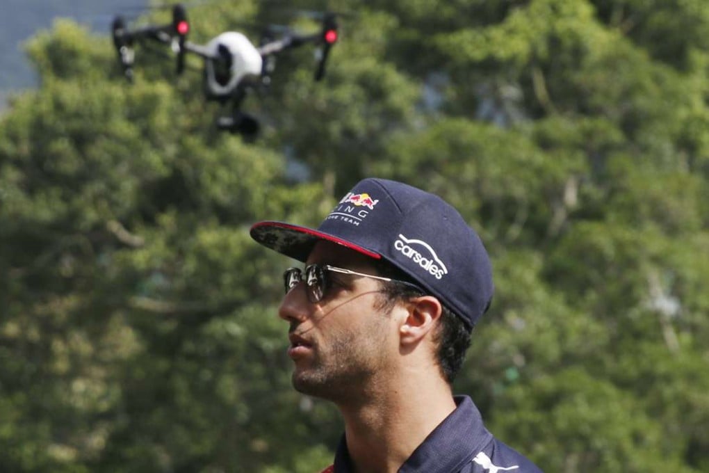A drone follows the moves of Formula One star Daniel Ricciardo of Red Bull during a press conference at Repulse Bay. Photo: Unus Alladin