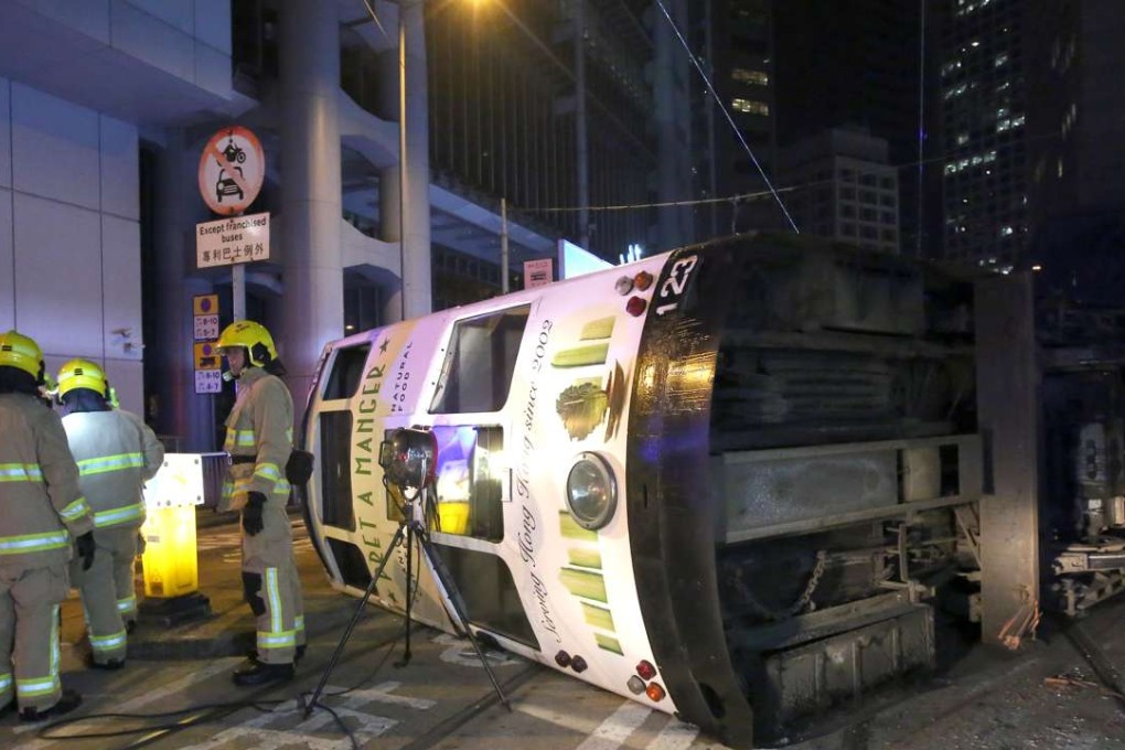 The tram flipped over on Des Voeux Road Central near Bank Street. Photo: Edmond So