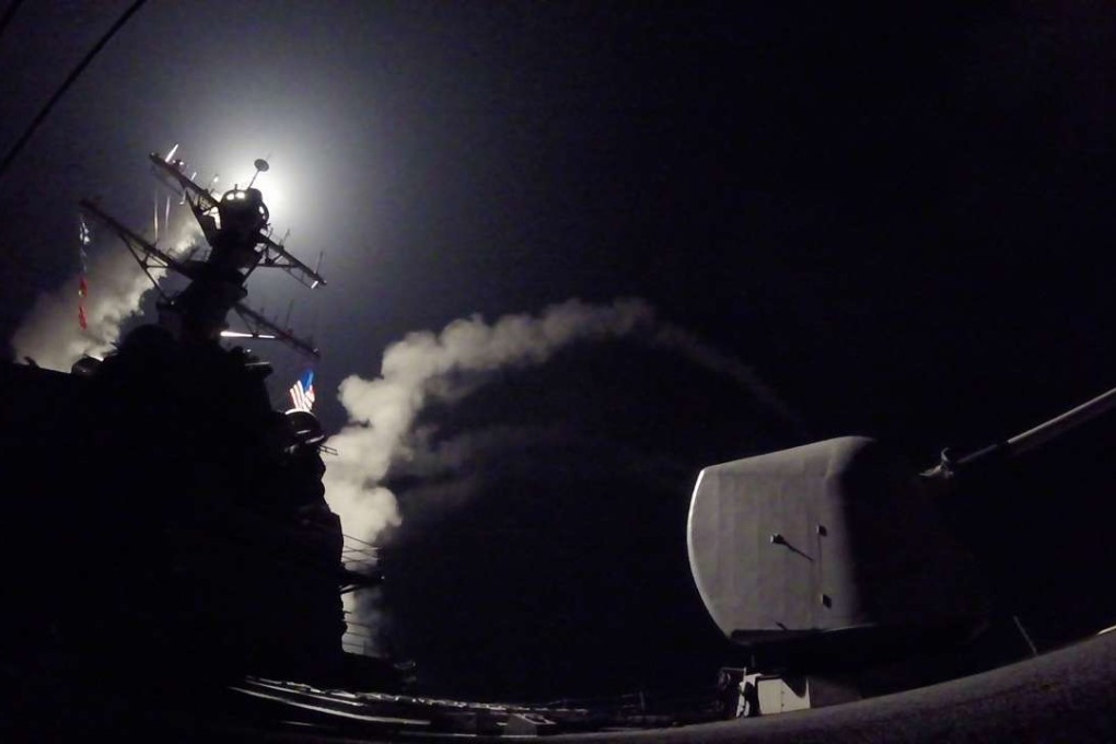 In this image released by the US Navy, the guided-missile destroyer USS Porter conducts a missile strike operation against a Syrian airbase. US President Donald Trump ordered the massive military strike on Thursday in retaliation for a "chemical attack he blamed on President Bashar al-Assad. Photo: AFP