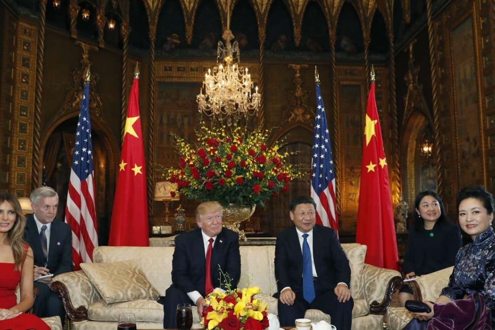 President Donald Trump and Chinese President Xi Jinping with their wives, first lady Melania Trump, left, and Chinese first lady Peng Liyuan, right, before a meeting at Mar-a-Lago. Photo: AP