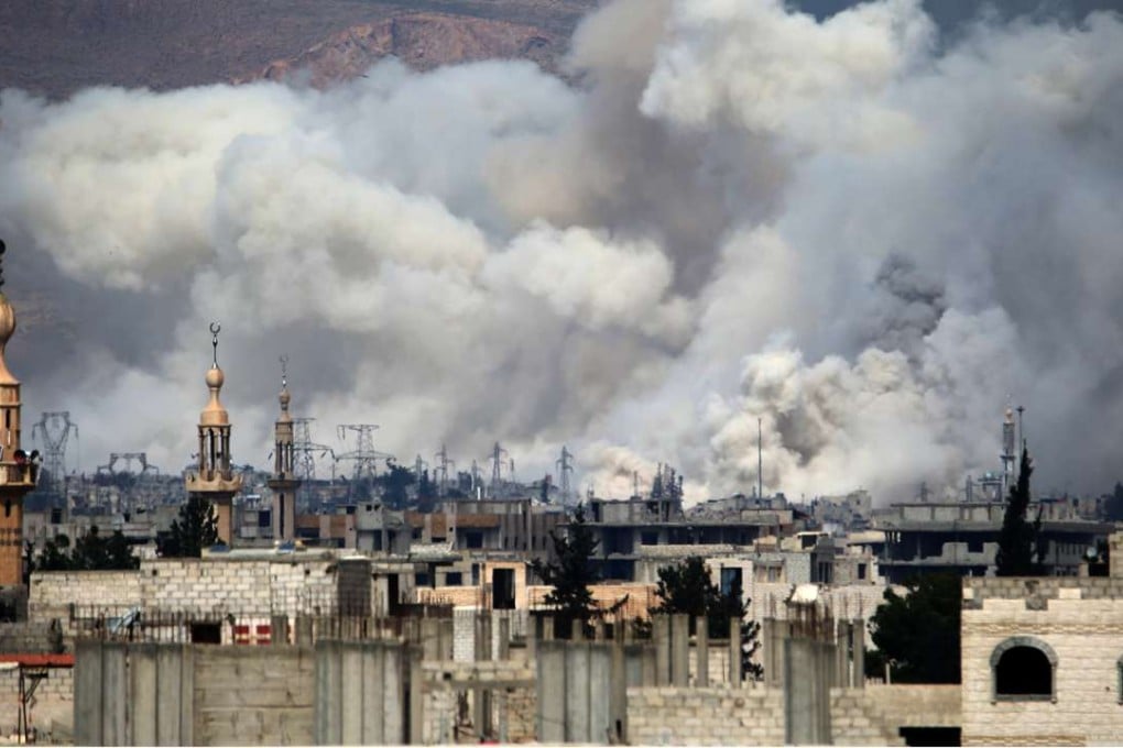 The aftermath of an air strike on March 15 by Syrian government forces on a rebel-held suburb of Damascus. Photo: AFP