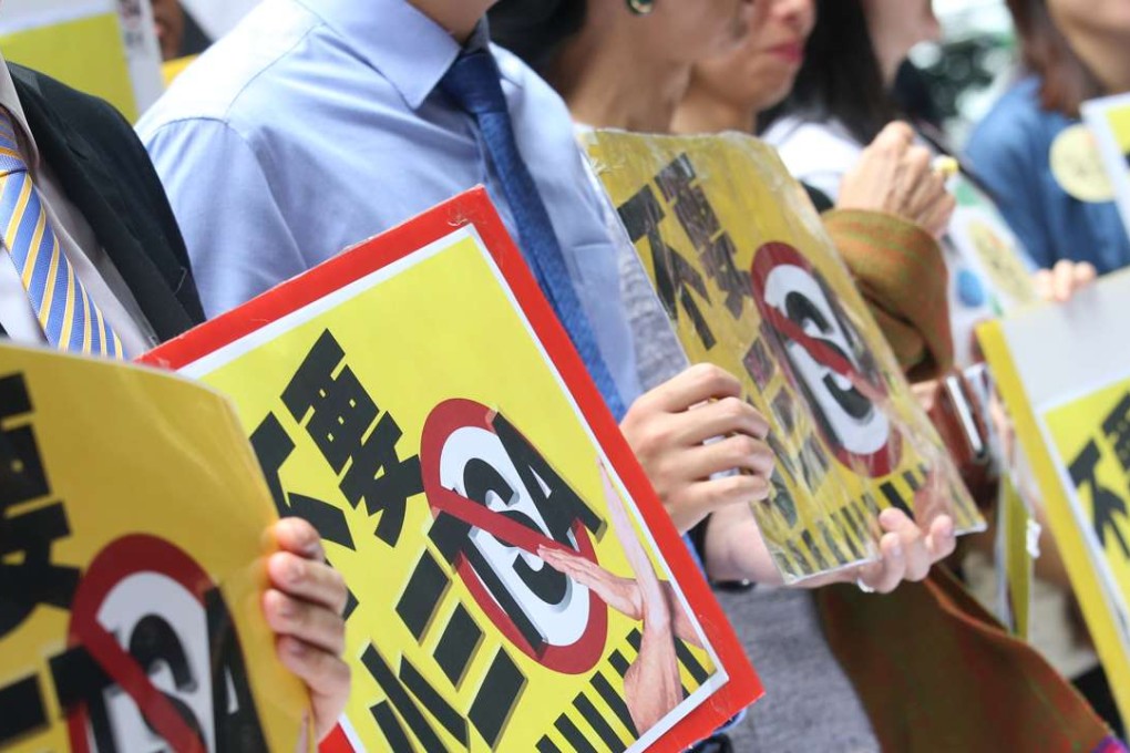 A parents’ concern group and lawmakers protest against the Territory-wide System Assessment (TSA) exam for primary students, in Wan Chai on April 6. Photo: Dickson Lee
