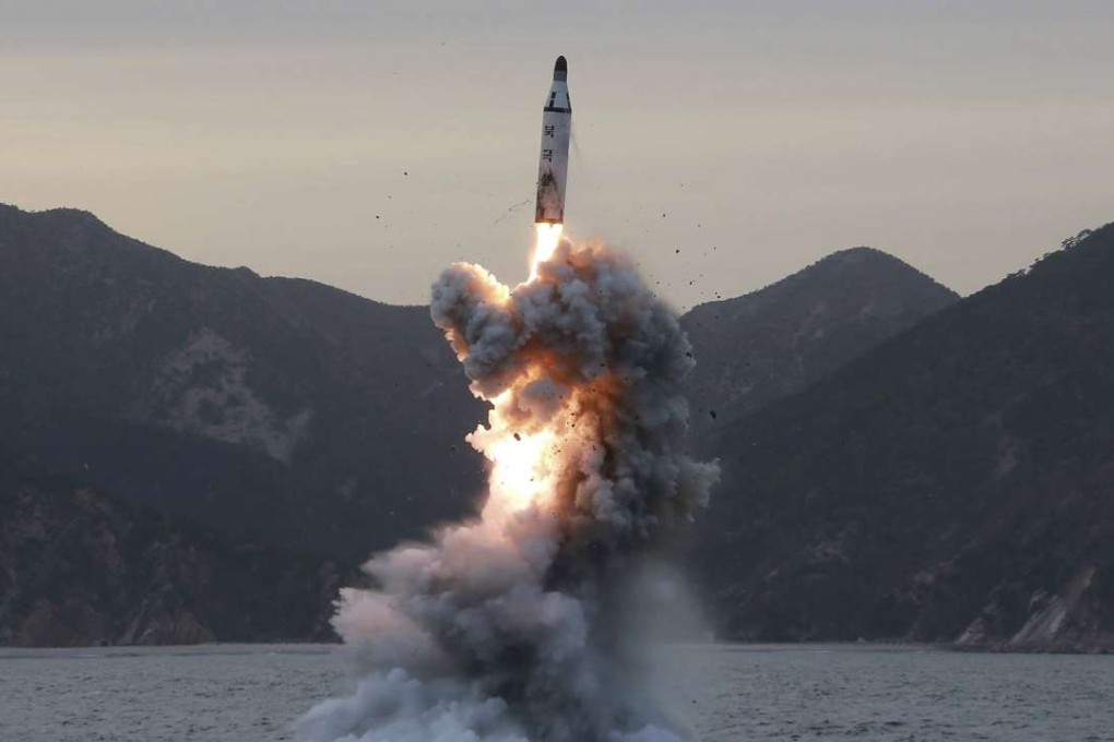 An undated photo released last April by the North Korean Central News Agency of a test firing of a missile from a submarine. Photo: EPA