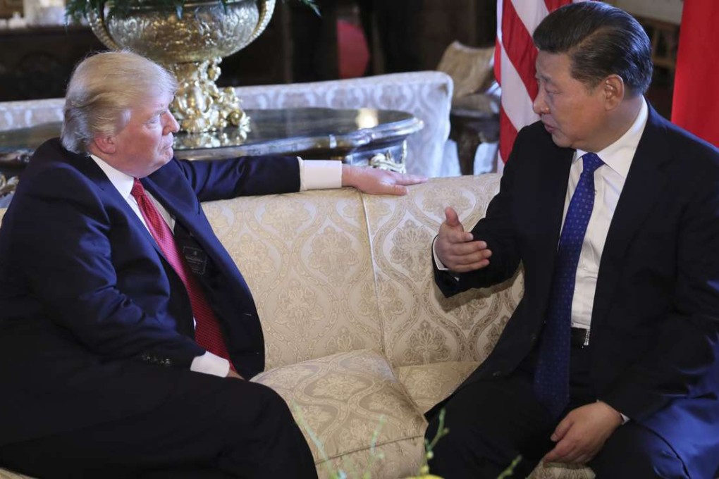 The Chinese media have played up a photo of the two leaders sitting on a sofa, with Xi gesticulating with his right hand to make a point as Trump listens in earnest. Photo: Xinhua