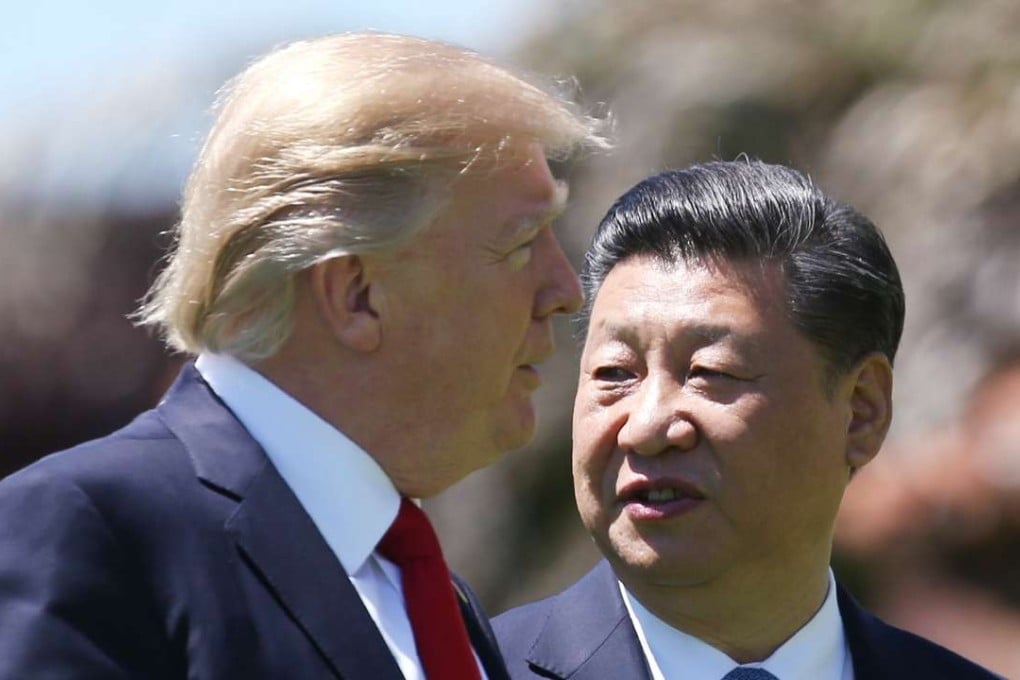 US President Donald Trump and China's President Xi Jinping walk along the front patio of the Mar-a-Lago estate after a bilateral meeting in Palm Beach, Florida on Friday. Photo: Reuters