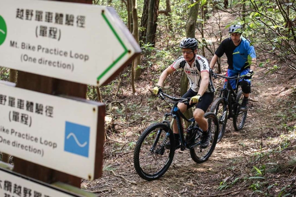 Mountain bikers ride along Tai Lam Mountain Bike Trail in Tai Mo Shan. Photo: Nora Tam