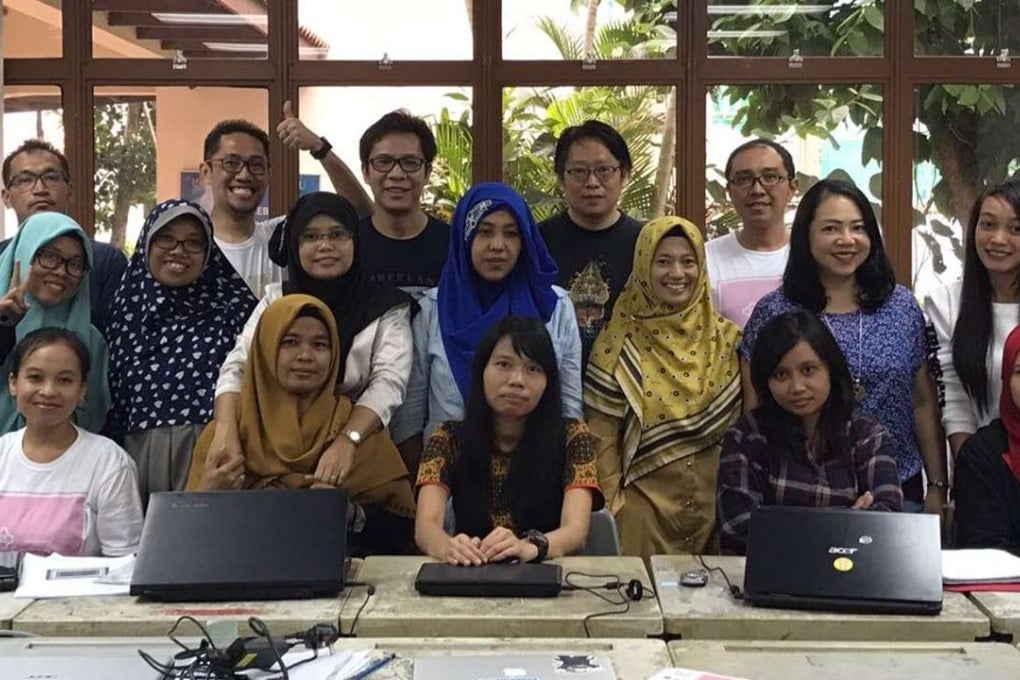 Participants and mentors at a coding class for Indonesian domestic workers in Singapore. Handout photo