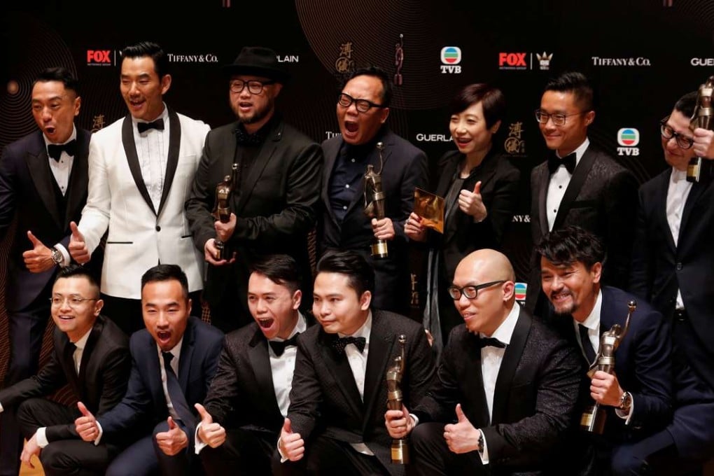 Actors, directors and producer of Trivisa pose after it won the best film and best director awards, among others, at the Hong Kong Film Awards in Hong Kong. Photo: Reuters