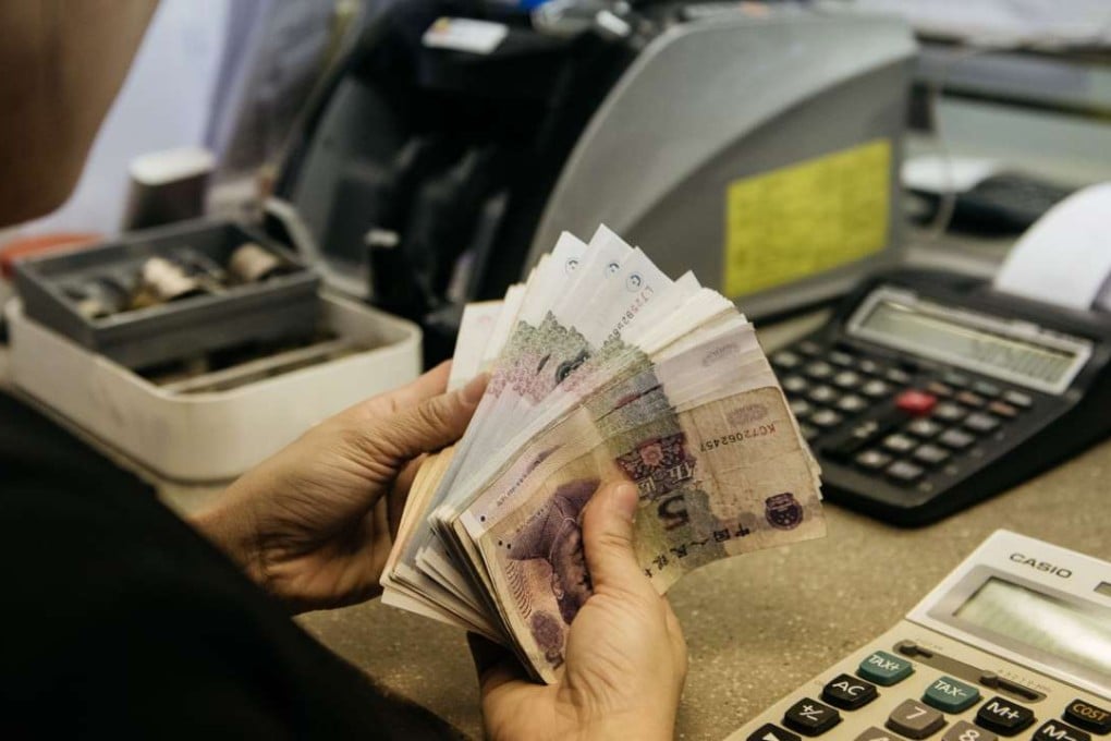 China’s yuan slipped against the US dollar in offshore and onshore trading on Monday. Photo: Bloomberg
