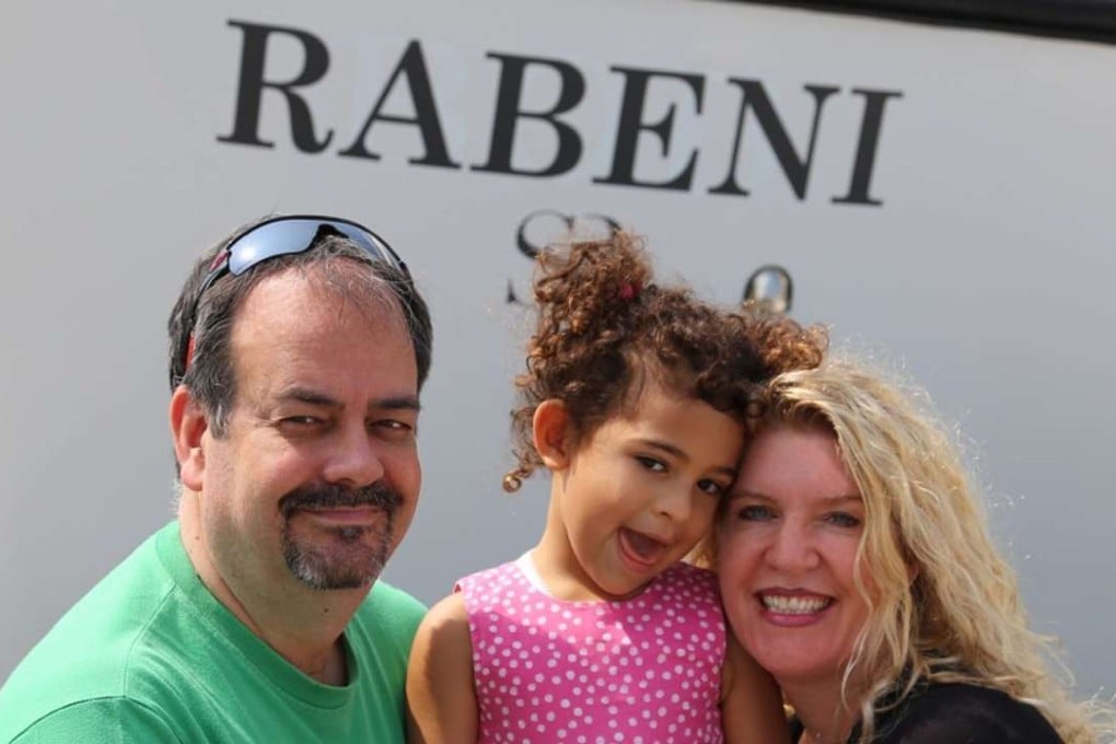 Steve Kean and Ayami and Susan Macdonald, in front of Macdonald’s boat, are spearheading the Seru Rabeni Fund. Photo: Sharon McEneff