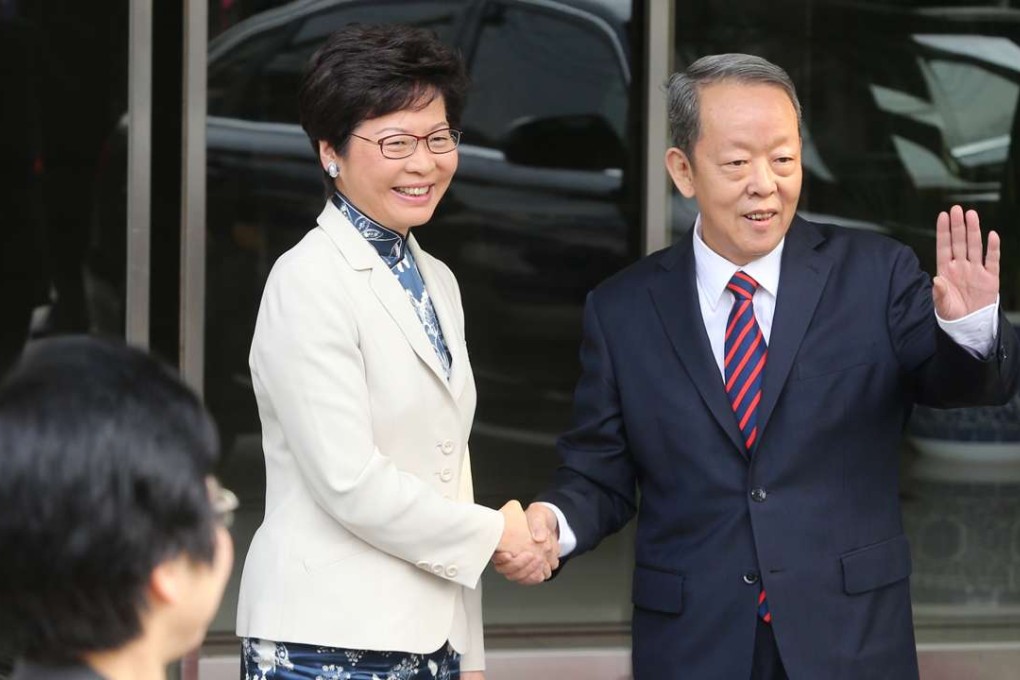 Chief executive-elect Carrie Lam greets Hong Kong and Macau Affairs Office director Wang Guangya in Beijing. Photo: Sam Tsang