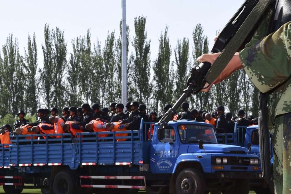 A truck carries criminals and suspects to a stadium for a mass sentencing rally in Yili, Xinjiang in this file photo from May 2014. Photo: Reuters