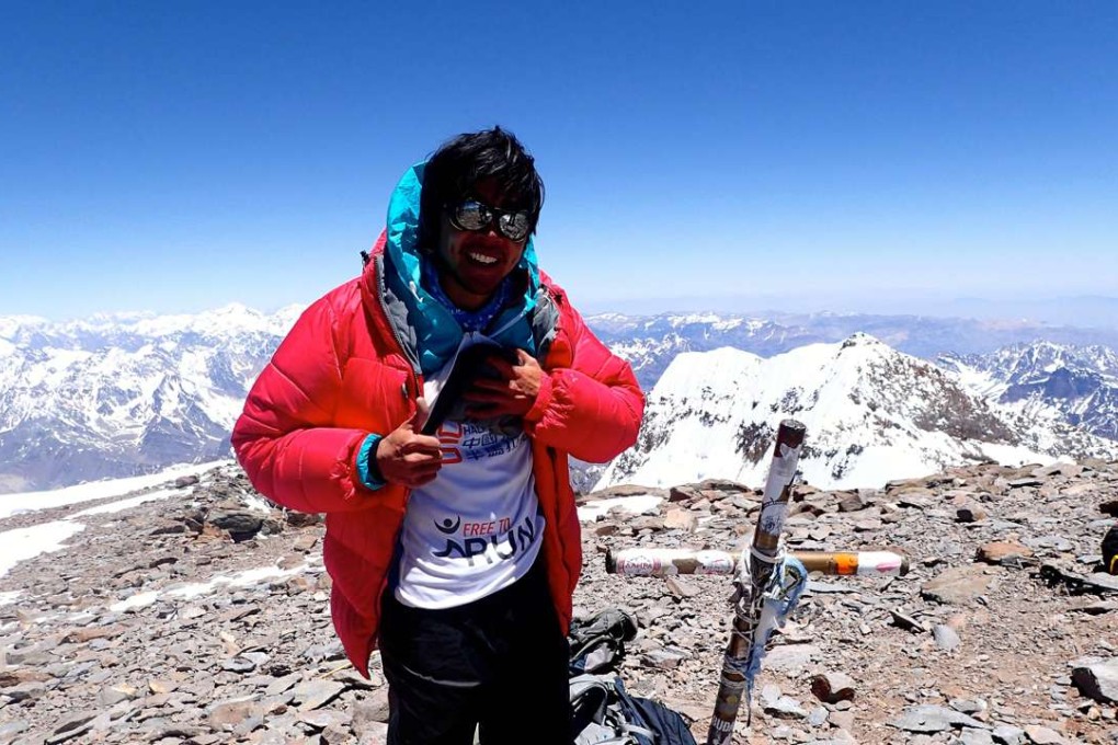 Loz Wong at the top of Mount Aconcagua, at 6,961 metres the highest peak in South America.