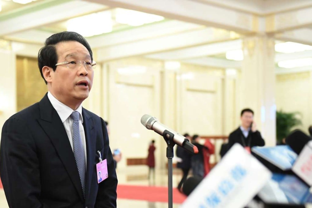 Xiang Junbo, chairman of China Insurance Regulatory Commission, speaking to the press on March 12, 2017. Photo: Xinhua