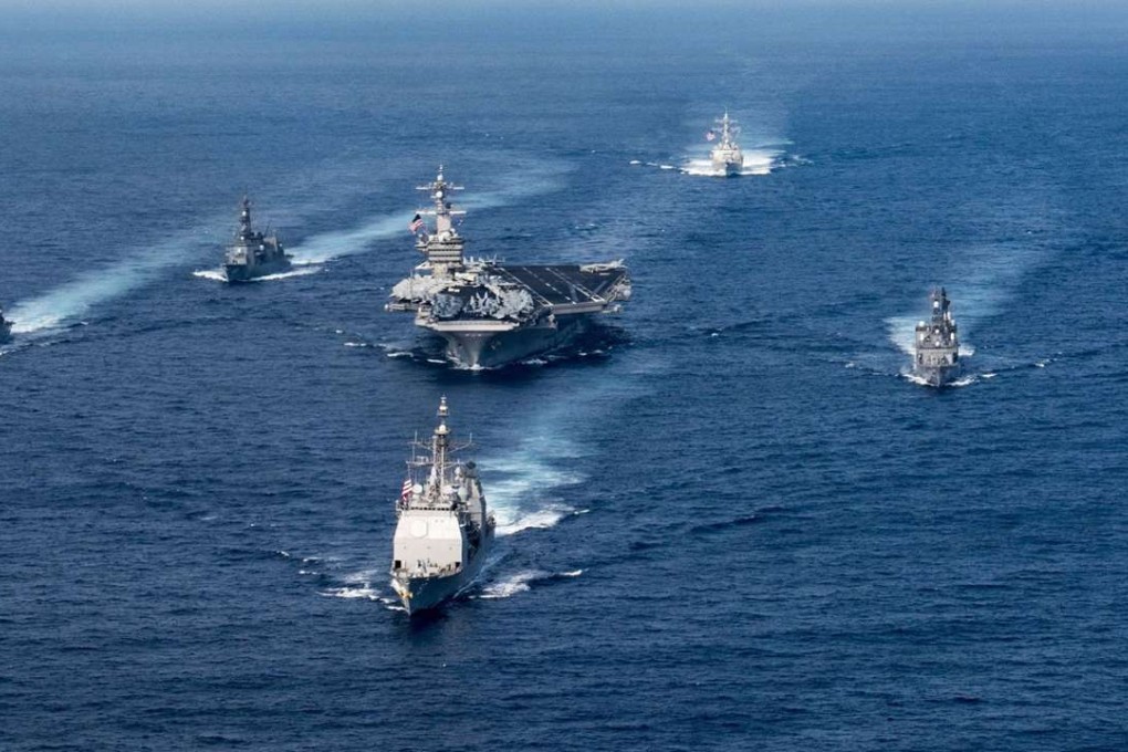 The aircraft carrier Carl Vinson (centre) sails in convoy in the Philippine Sea in March. The carrier has been sent to the western Pacific. Photo: AFP