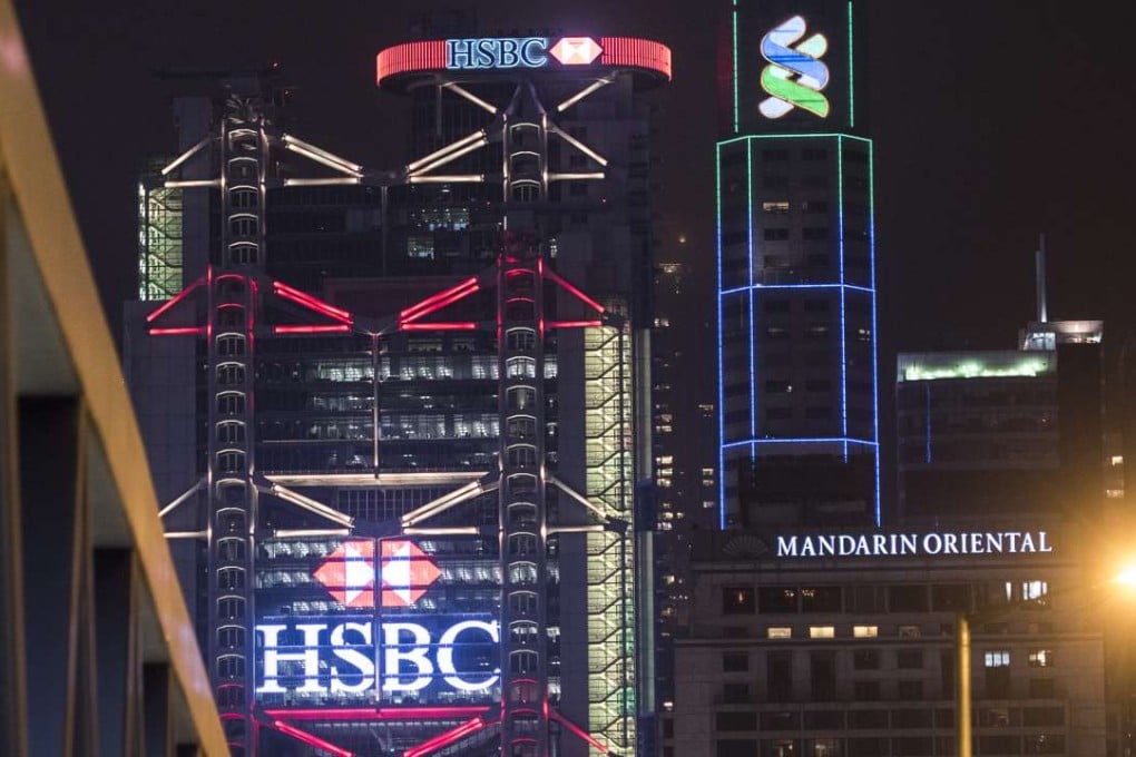 The city’s largest bank, HSBC is seen to impose the toughest customer conditions, following its US$1.9 billion penalty in 2012 for breaching American money-laundering rules, while its next door neighbour Standard Chartered said it could still not give definitive details on its planned measures, only that it updates client information on a regular basis. Photo: Bloomberg