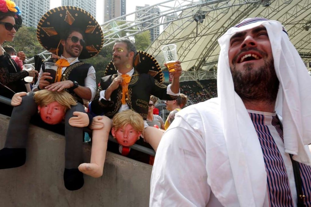 Rugby fans having a blast on Saturday. Those earning HK$16,000 a month may find it hard to shell out HK$1,800 for the three-day ticket package, HK$130 for a litre of draft beer, HK$65 for a cup of coffee, HK$50 for a bottle of water or HK$120 for a double cheeseburger. Photo: Reuters