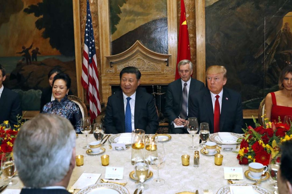 US President Donald Trump and Chinese President Xi Jinping, with their wives, first lady Melania Trump and Chinese first lady Peng Liyuan are seated during a dinner at Mar-a-Lago in Palm Beach. Photo: AP