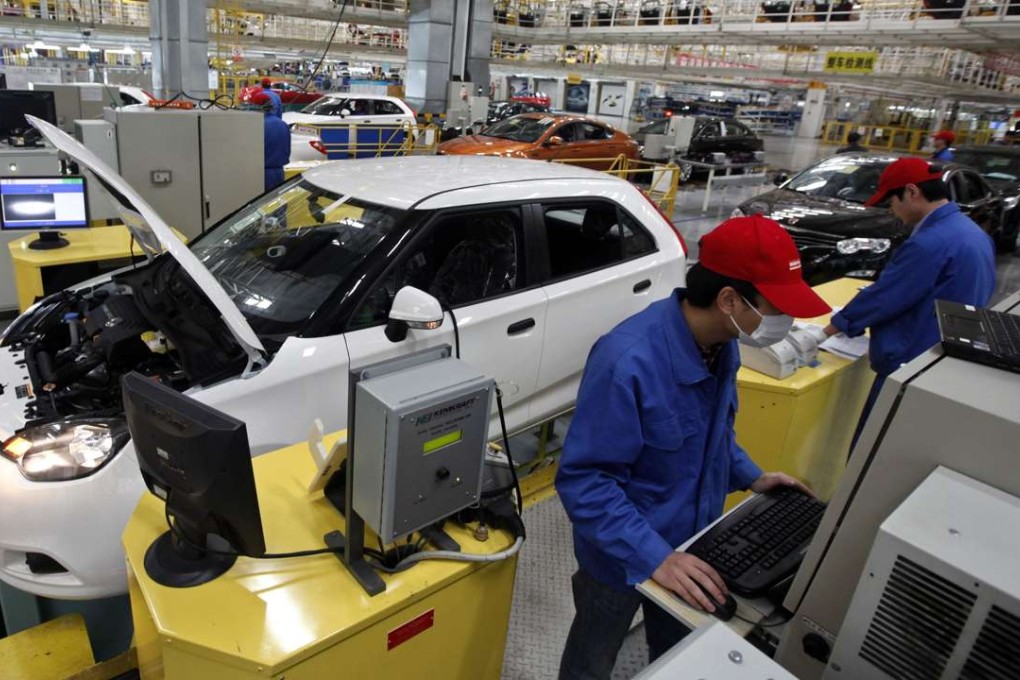 Employees on an assembly line at an automobile factory of SAIC Motor in Shanghai in April 2012. Photo: REUTERS