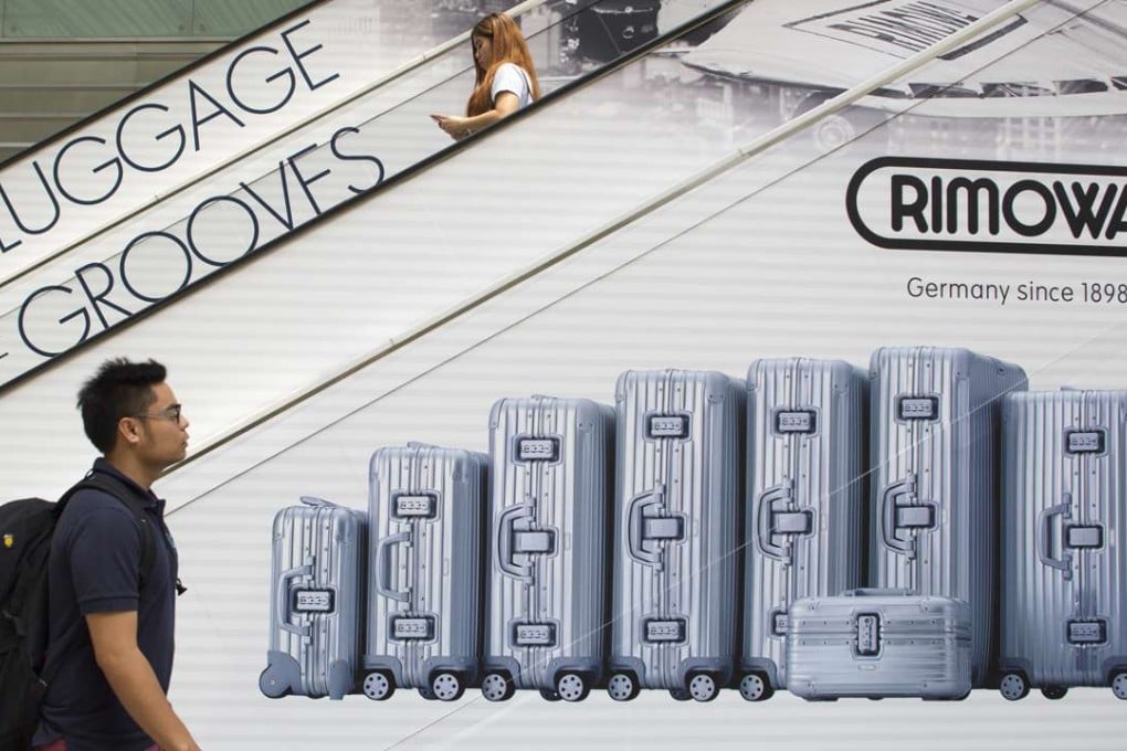 Cathay Pacific staff were initially asked to affix tags, but not stickers, to Rimowa suitcases. Photo: Bloomberg