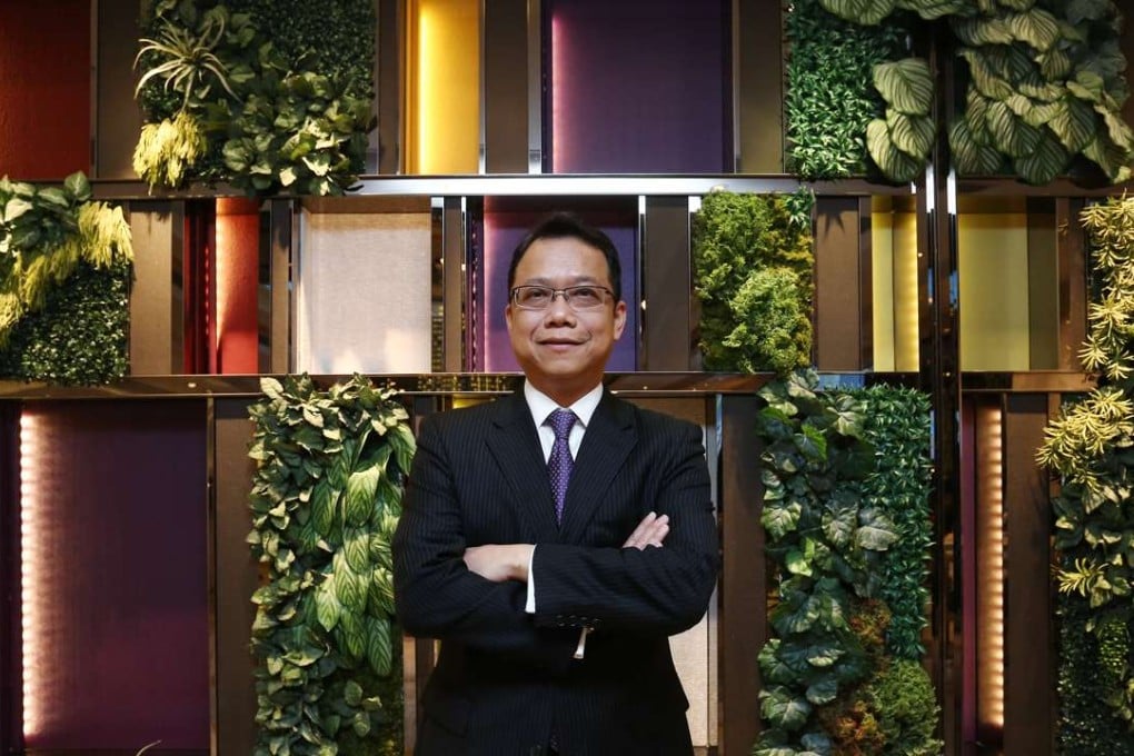 Oliver Lam , chief financial officer of K. Wah International Holdings, poses for a picture in North Point. 05APR17 SCMP / Jonathan Wong