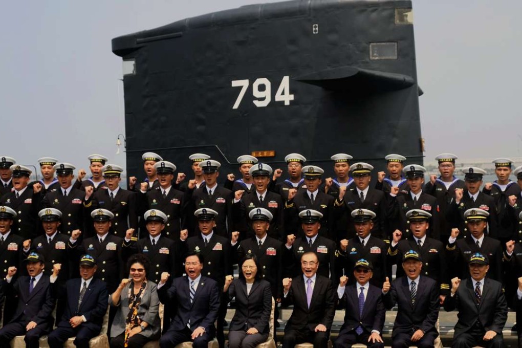 Taiwanese President Tsai Ing-wen (front row, centre) poses for photos with naval officers in front of a Dutch-made Sea Tiger submarine at the Tsoying Naval Base in Kaohsiung in March, where she unveiled her plan to launch eight home-grown submarines in the next decade. Photo: AFP