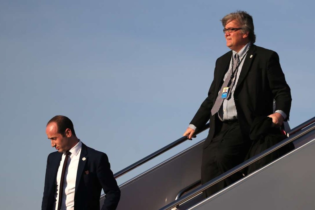 White House Chief Strategist Steve Bannon (right) and Senior Adviser Stephen Miller arrive aboard Air Force One at Joint Base Andrews, Maryland, on Saturday. Photo: Reuters