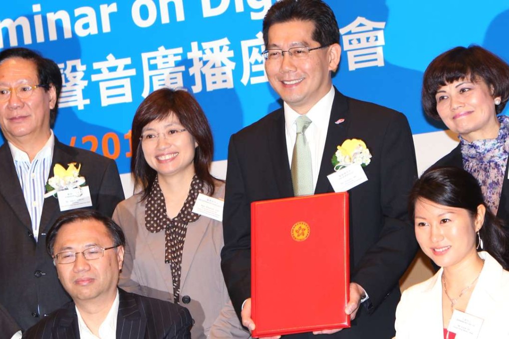 Commerce and Economic Development Secretary Greg So Kam-leung and then permanent secretary Elizabeth Tse Man-yee (back row, second and third right), with top management from Digital Broadcasting Corporation, Metro Broadcast Corporation and Phoenix U Radio, at the signing ceremony for the digital audio broadcasting network sharing agreement at the Convention and Exhibition Centre in Wan Chai, on October 13, 2011. Photo: Felix Wong