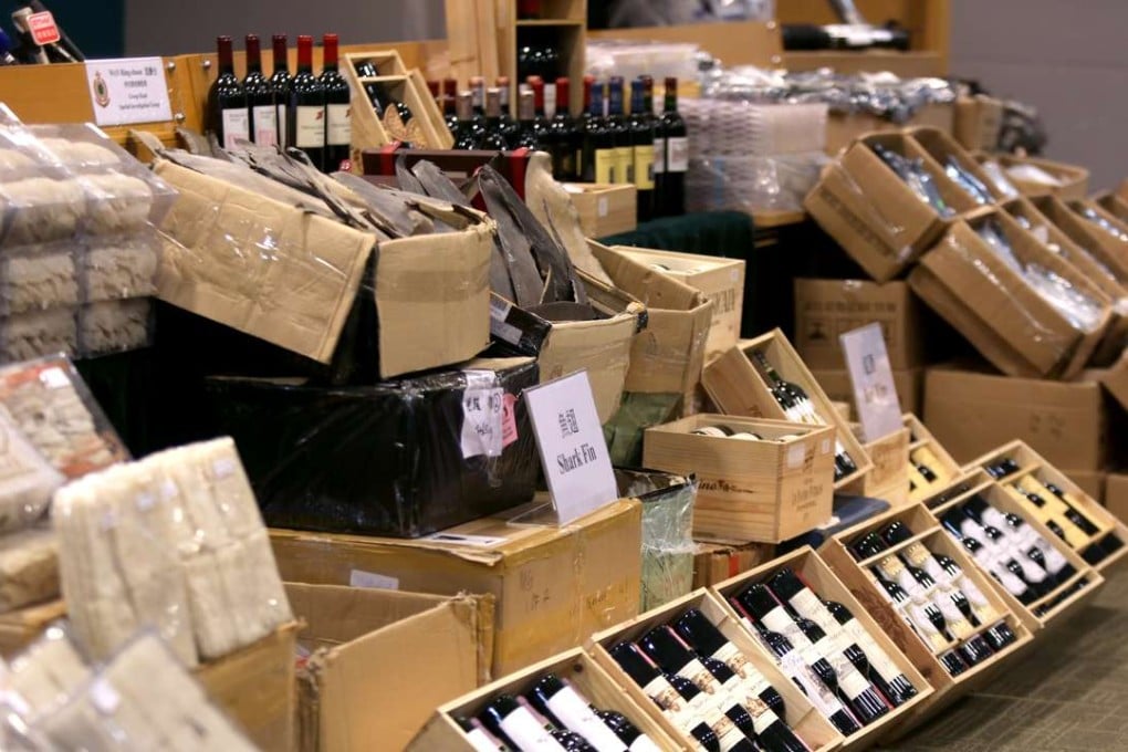 Shark fin, wine and bird’s nest all seized by customs officers from an alleged smuggling syndicate on Tuesday. Photo: Xiaomei Chen